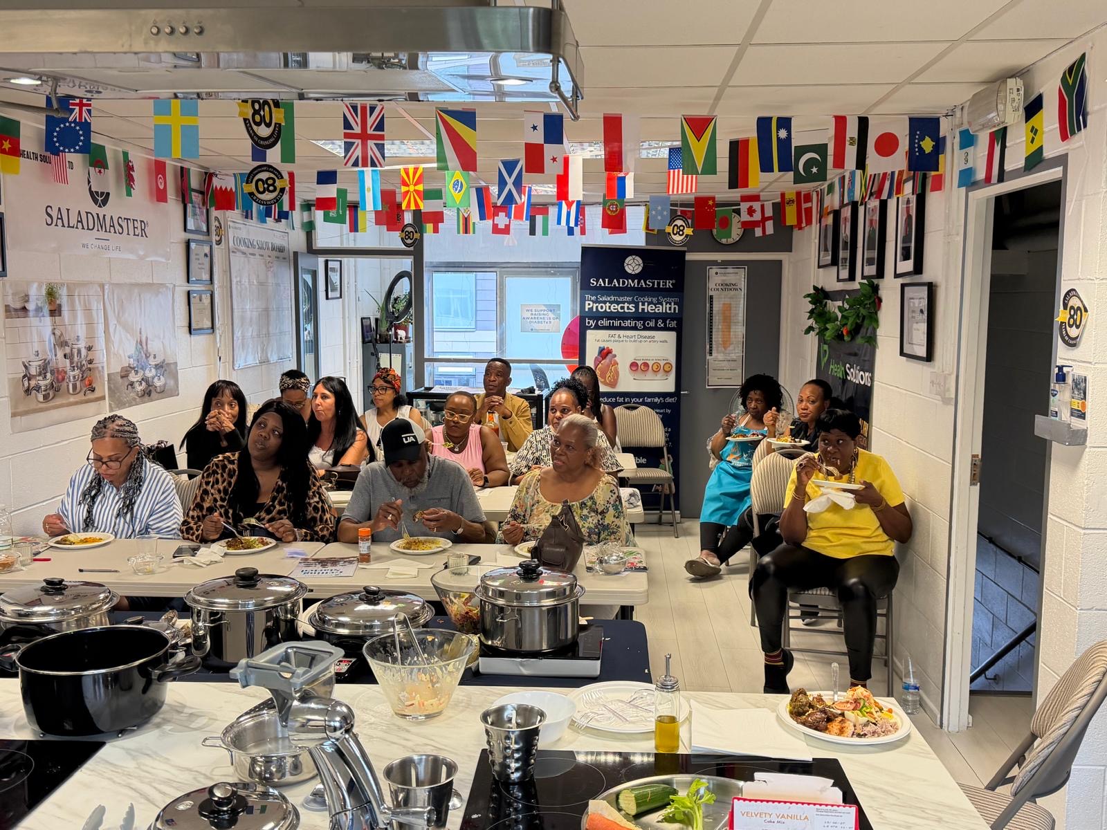 Guests enjoying a live Saladmaster cooking show