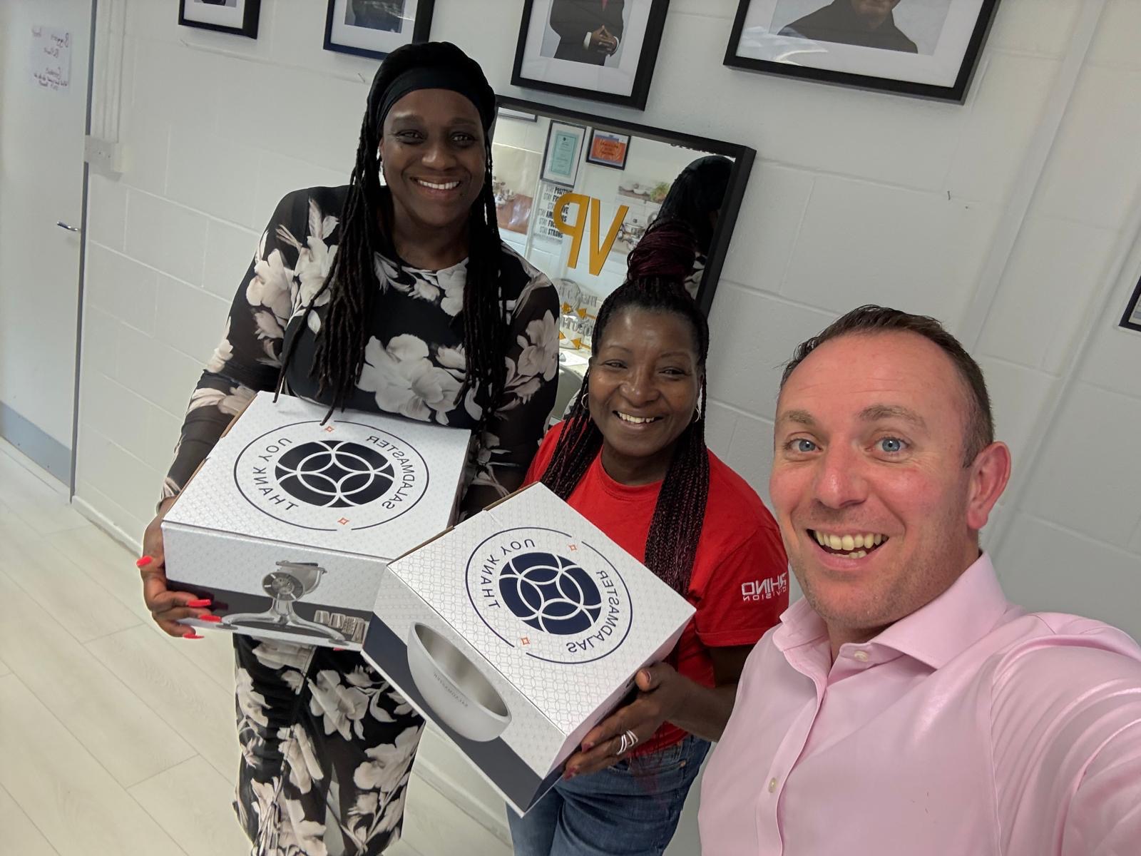 Happy customers receiving their Saladmaster cookware